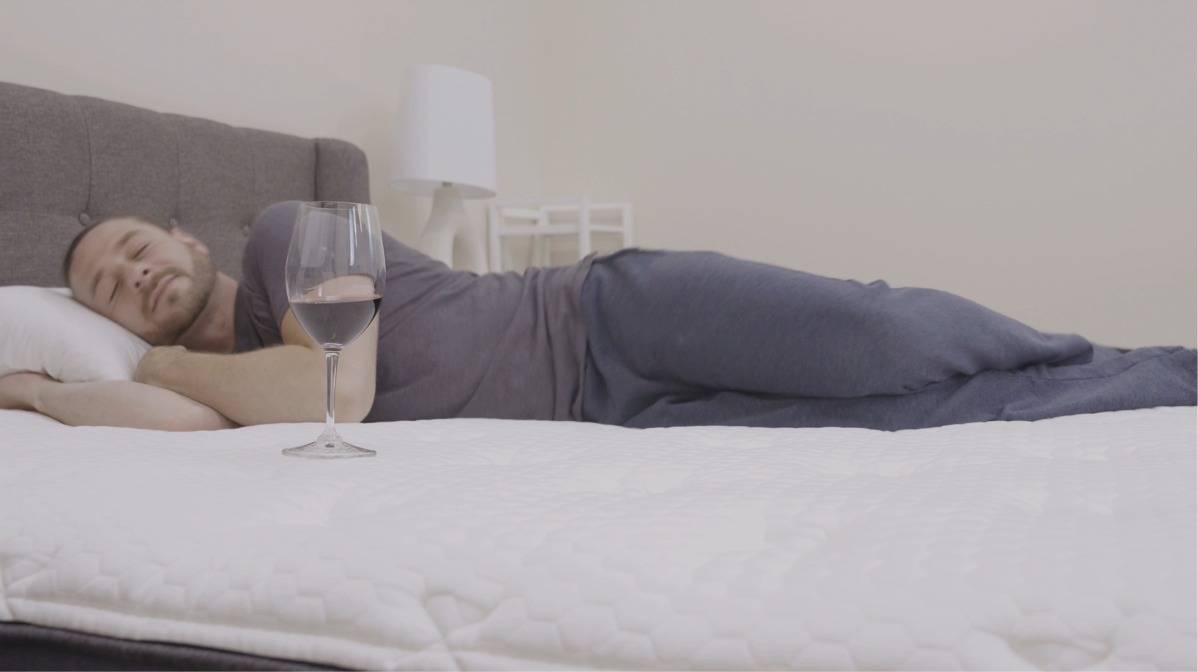 Helix Midnight Luxe Mattress Review Helix Midnight Lux Mattress Review by Sleep Examiner - Motion Transfer Test with wine glass
